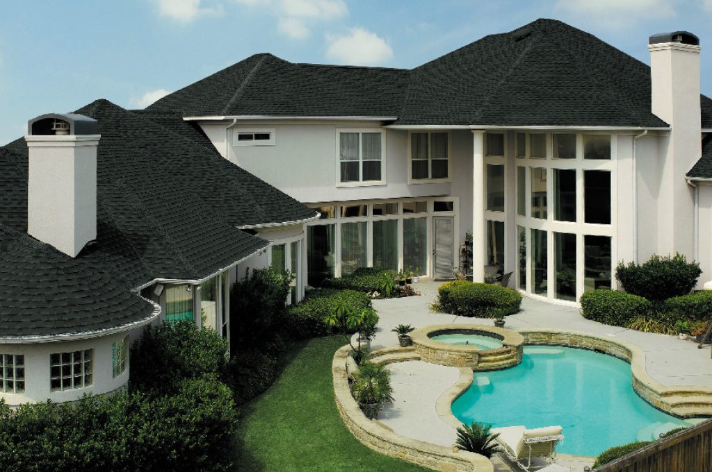 A large house with a pool and patio area.