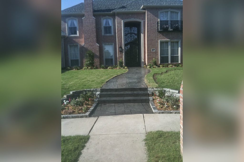 A house with steps leading to the front door.
