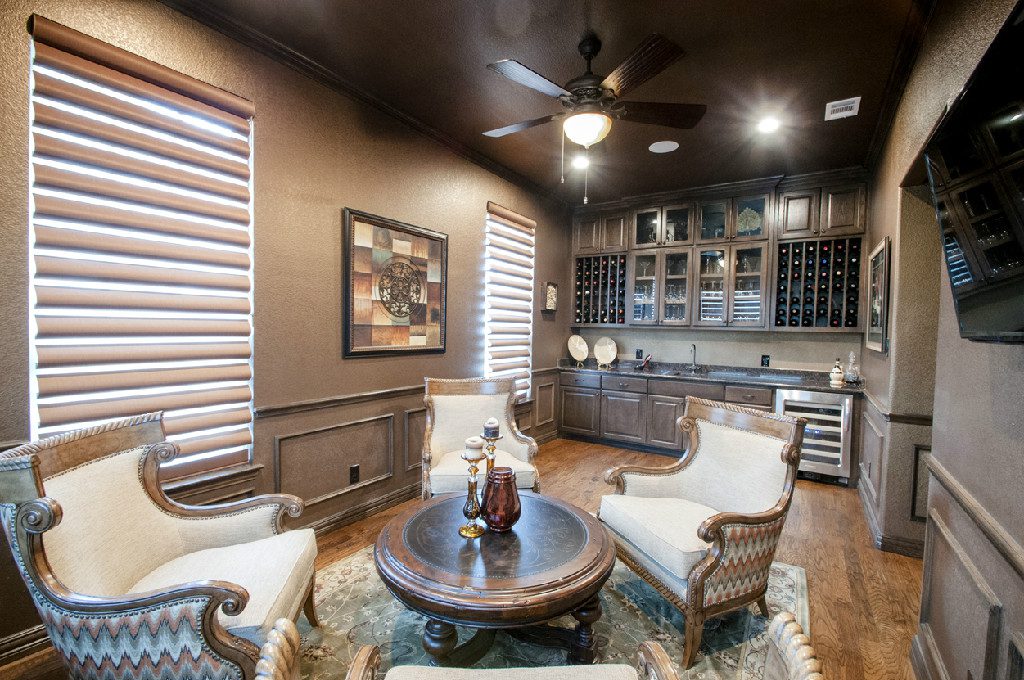 A living room with two chairs and a table